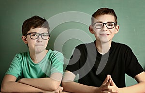 Short sighted teen boys in myopia glasses photo