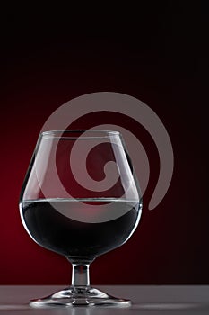 Short-stemmed glass on a dark background