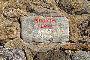 Short-term debt cycle symbol. Concept words Short-term debt cycle on beautiful big grey stone. Beautiful stone wall background.