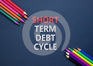 Short term debt cycle symbol. Concept words Short term debt cycle on beautiful black paper. Beautiful black background. Colored