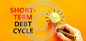 Short-term debt cycle symbol. Concept words Short-term debt cycle on beautiful orange paper. Beautiful orange background.