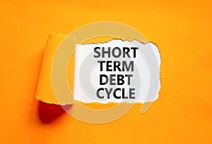 Short term debt cycle symbol. Concept words Short term debt cycle on beautiful white paper. Beautiful orange background. Business