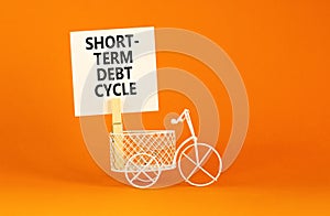 Short-term debt cycle symbol. Concept words Short-term debt cycle on beautiful white paper on clothespin. Bicycle model. Beautiful