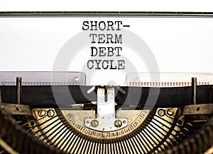 Short-term debt cycle symbol. Concept words Short-term debt cycle typed on beautiful old retro typewriter. Beautiful white