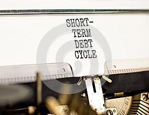 Short-term debt cycle symbol. Concept words Short-term debt cycle typed on beautiful old retro typewriter. Beautiful white