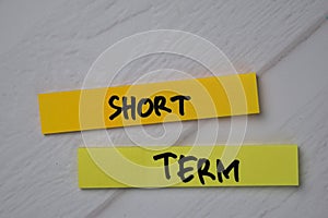 Short Term text on sticky notes isolated on office desk