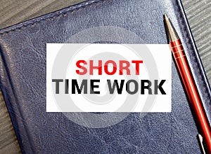 SHORT TIME WORK. text on white paper on gray background