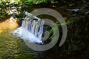 Short water cascade on Sutov Creek in Mala Fatra mountains, northern Slovakia