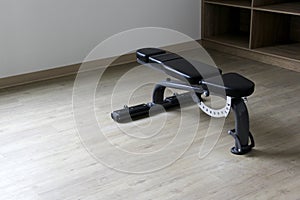 Short weight bench to exercise in gym alone on wooden floor for healthy life and start a better lifestyle