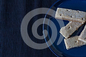 Shortbread on a blue plate with tablecloth