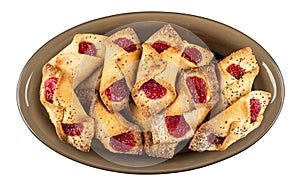 Shortbread cookies with jam in dish isolated on white. Top view