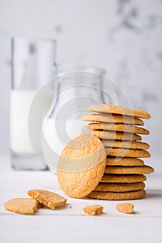 Shortbread kamut cookies with glass and jug of milk