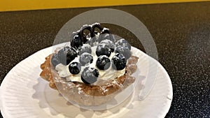 Shortcake tart with whipped cream and fresh blueberries