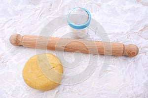 Shortcrust pastry with a rolling pin and flour drifter photo