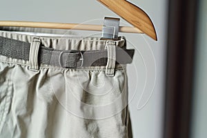 shorts with belt on hanger, closeup on waistband