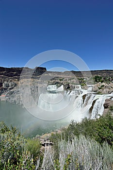 Shoshone Falls Twin Falls Idaho mist grassy foreground masthead text area wide angle vertical