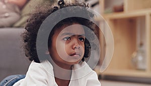 When can I get a chance to choose a movie. Shot of an adorable little boy lying down on a carpet and watching tv at home