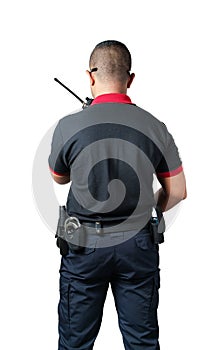 shot from the back Security guards talk radios There are rubber batons and handcuffs on the tactical belt. on a isolated white