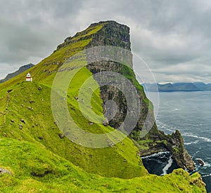 Shot Of Beautiful Panoramic Scene, Kalsoy Island and Kallur lighthouse, Faroe Islands photo