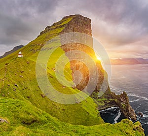 Sunrise Over Kalsoy Island and Kallur lighthouse, Faroe Islands photo