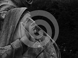 Female nun figure praying photo