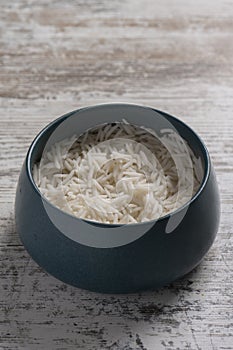 Shot of bowl of rice on wooden tabletop