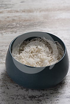 Shot of bowl of rice on wooden tabletop