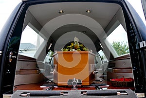 Shot of a colorful casket in a hearse or chapel before funeral or burial at cemetery