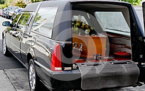 Shot of a colorful casket in a hearse or chapel before funeral or burial at cemetery