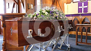 Shot of a colorful casket in a hearse or chapel before funeral or burial at cemetery