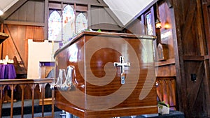 Shot of a colorful casket in a hearse or chapel before funeral or burial at cemetery