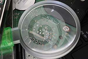 Shot of a computer processor through a magnifying glass