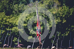 Shot of a Confederate battle flag with rifles during the Civil War reenactment