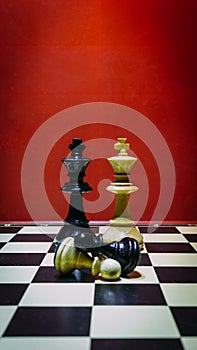 Shot of the confrontation between white and black chess pieces standing on a chessboard