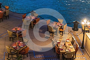 Shot of a cozy outdoor cafe by the water. Leisure