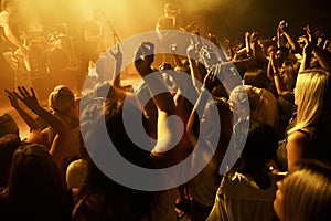 Shot of a crowd dancing at a rock concert. This concert was created for the sole purpose of this photo shoot, featuring