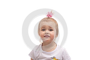 Shot of a cute  little girl with pink bow in her blonde hair and blue eyes, isolated