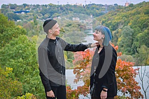 Shot of a dangerous man choking smiling blue hair girl