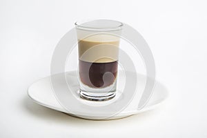 A shot of dark brown cocktail drink called B52