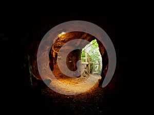 Shot of the exit of a dark cave