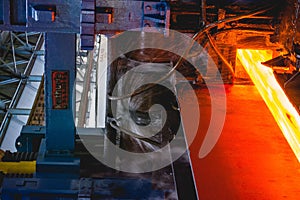 Shot of a factory during the work of machineries with hot metals