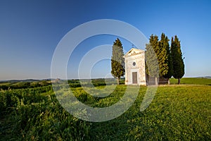 Shot of the famous historic Chapel Vitaleta in the middle of a field in Italy