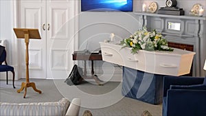 Shot of a funeral casket in a hearse or chapel or burial at cemetery