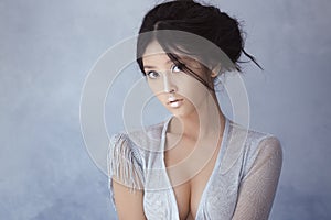 Shot of a futuristic tender young asian woman.