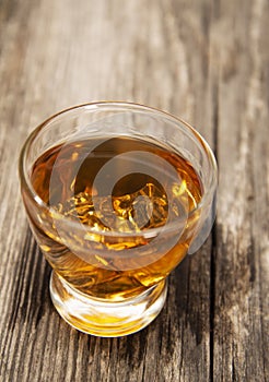 Shot glass of bourbon whiskey