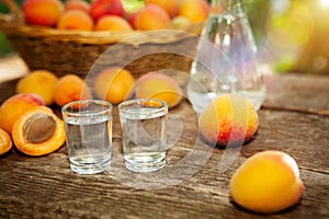 Shot glass with fruit brandy and apricots