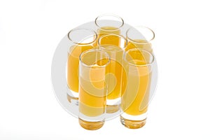 Shot Glasses with orange flavoured Alcoholic shots photo