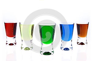 Shot glasses of liqueurs