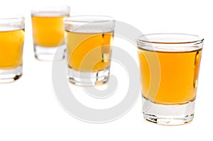Shot glasses of whiskey