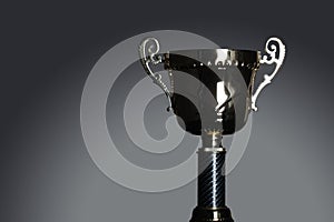 Shot of gold award trophy in gray background